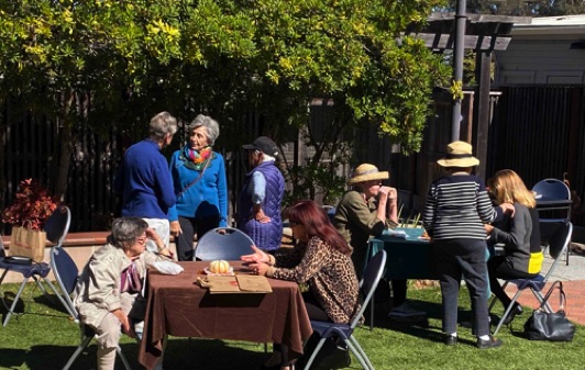 In October we launched sales of the "What Sustains Us" cookbook with a gathering on the Community Center Patio.